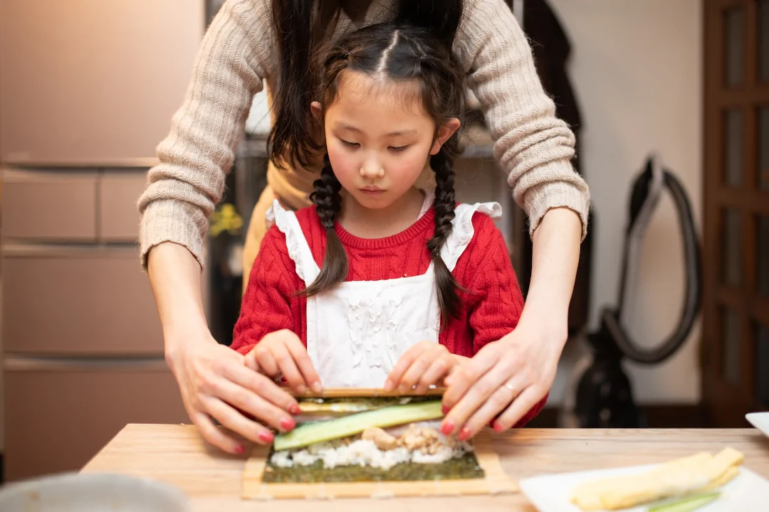 helping to make sushi