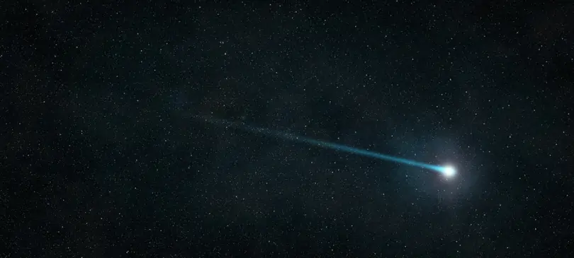 What causes a shooting star in the night sky?